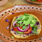 tostadas de papa potato tostada on a mexican plate.