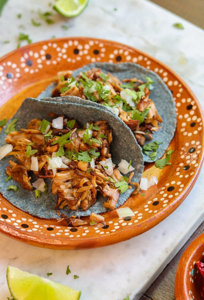 jackfruit tacos on a mexican plate.