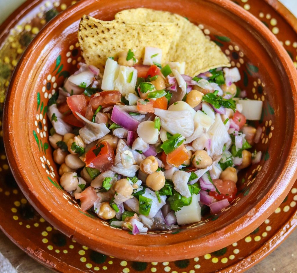 vegan ceviche in a Mexican bowl with tortilla chips.