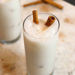 two glasses of horchata on a white counter.