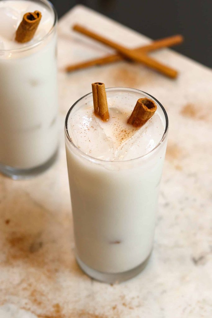 two glasses of horchata on a white counter.