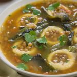 chochoyotes in lentil soup in a bowl.