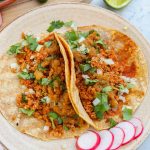 vegan street tacos on a plate with salsa.