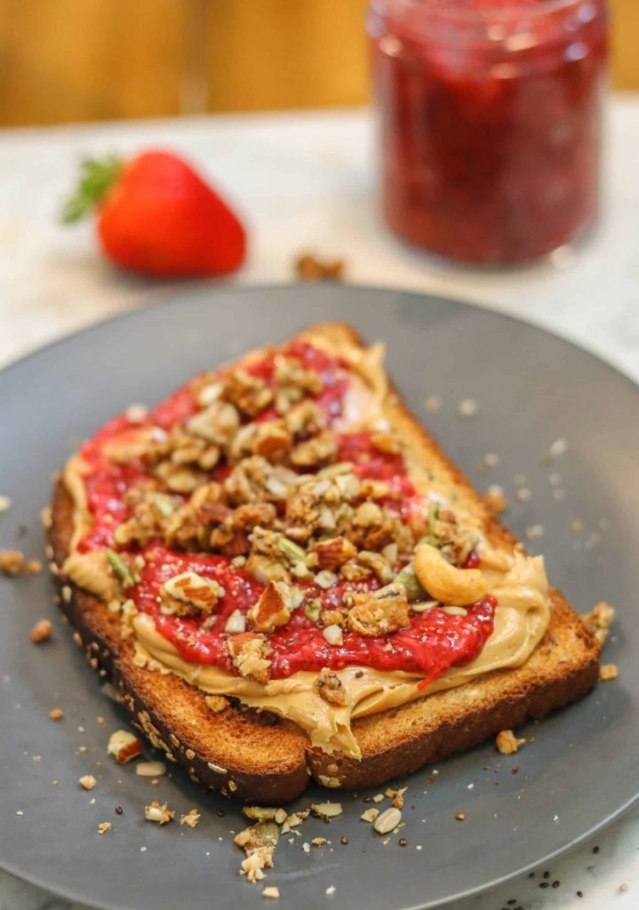 chia jam on a slice of whole wheat toast and peanut butter.