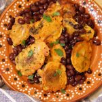 vegan tortitas de verduras on a plate with beans.