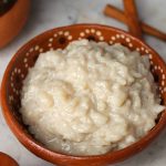 Vegan Arroz con Leche in a small mexican dish.