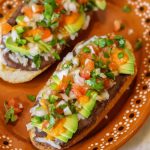 molletes on an authentic mexican plate.